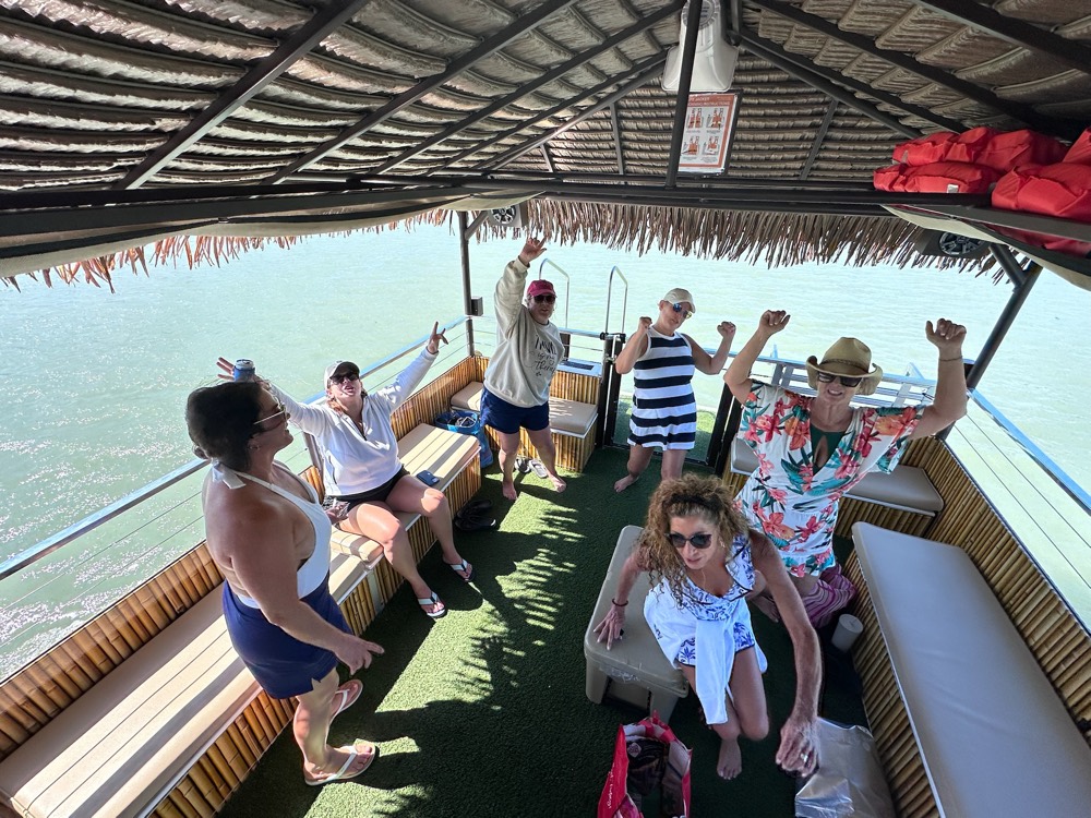 A group celebrating aboard the tiki boat near Marco Island, Florida