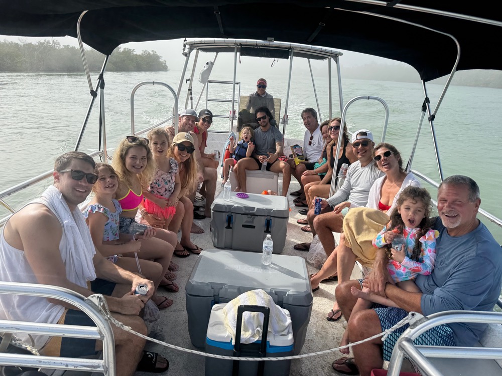 A group celebrating a special occasion on a private boat near Naples, Florida