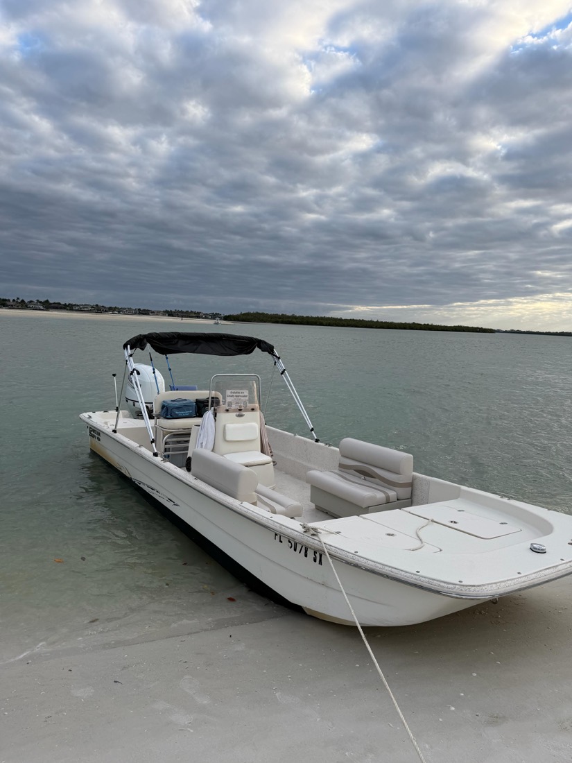 The Sand Dollar center console boat on a calm Marco Island waterway, Florida