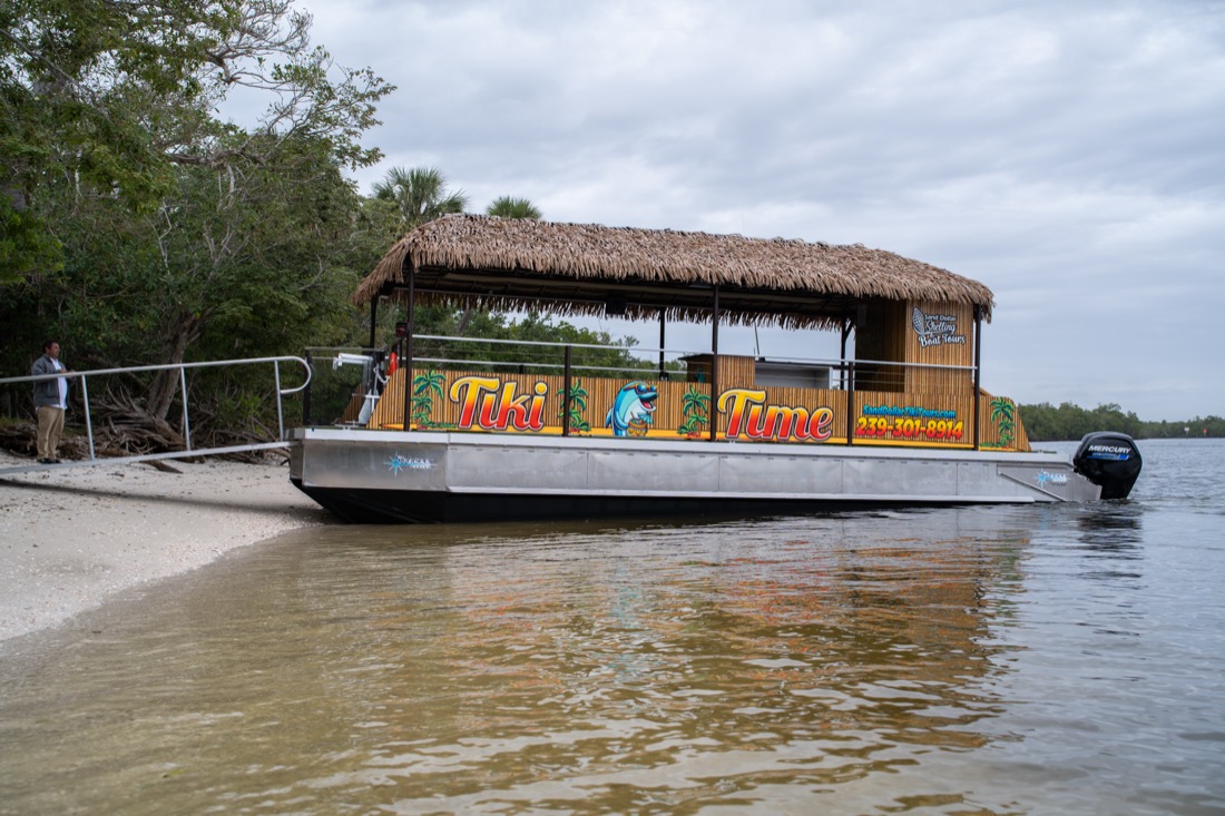 The one-of-a-kind Tiki Time thatched-roof boat from the Sand Dollar fleet, Marco Island, Florida