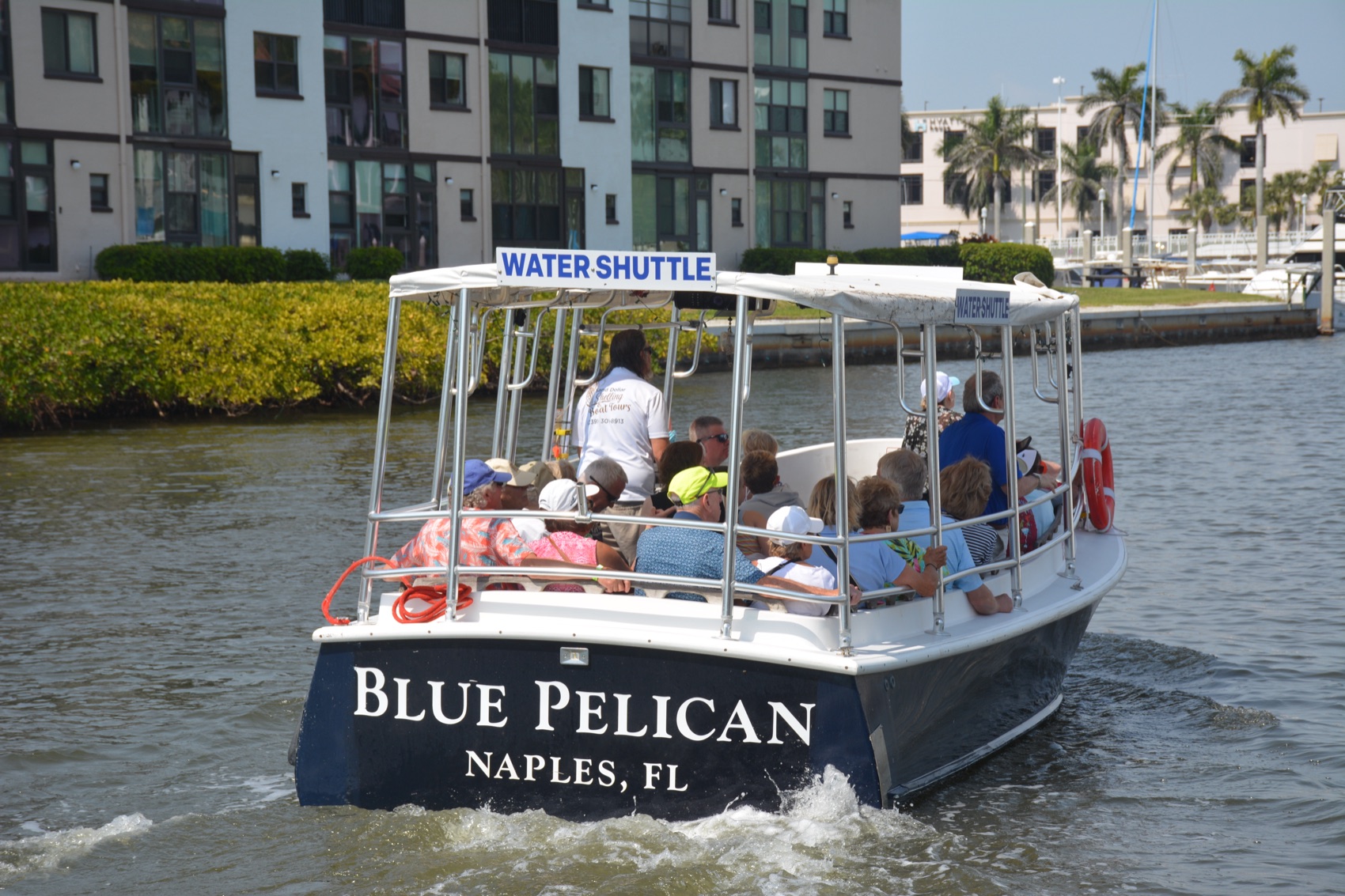 A water shuttle getting around Naples Bay, Florida