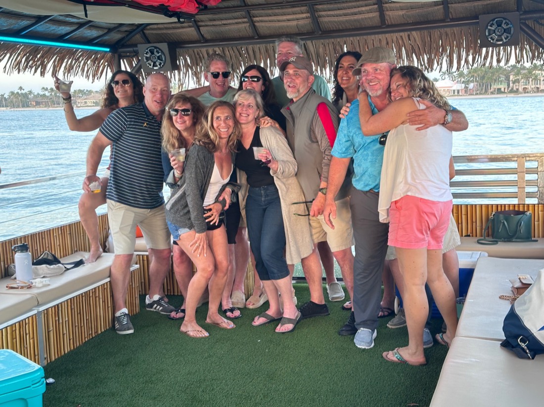 A happy tour group aboard the Sand Dollar tiki boat in Naples, Florida