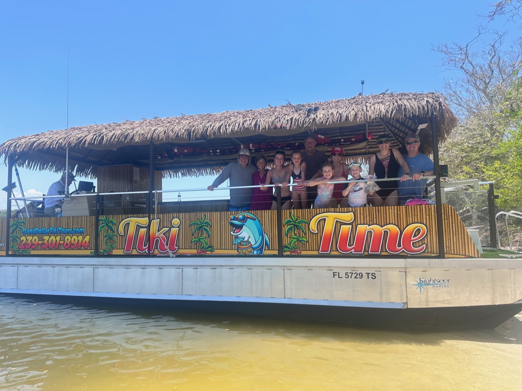 Sand Dollar’s thatched-roof tiki boat on the water near Naples, Florida