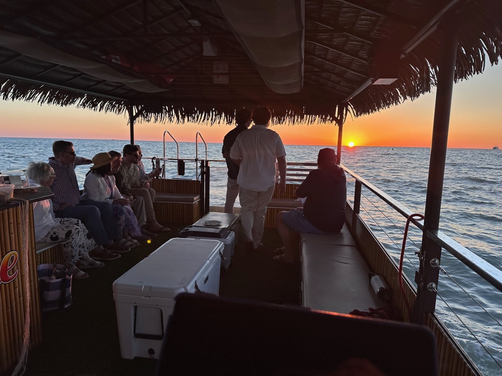 The Sand Dollar tiki boat at golden hour near Naples, Florida
